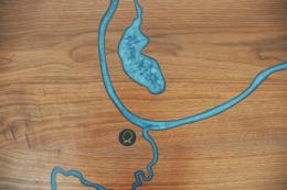 CNC Engraved Walnut River Table With Embedded Objects 1