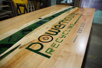 Engraved Conference Table With Epoxy Filled CNC Logo