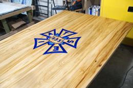 IATSE 835 Elm Conference Table - Epoxy Resin CNC Logo